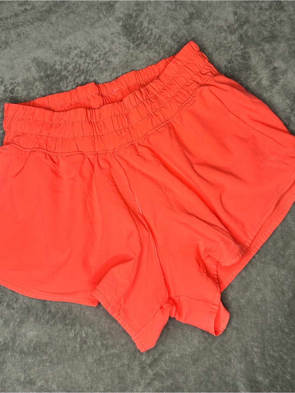 Women’s Smocked Waist Athletic Shorts in Coral